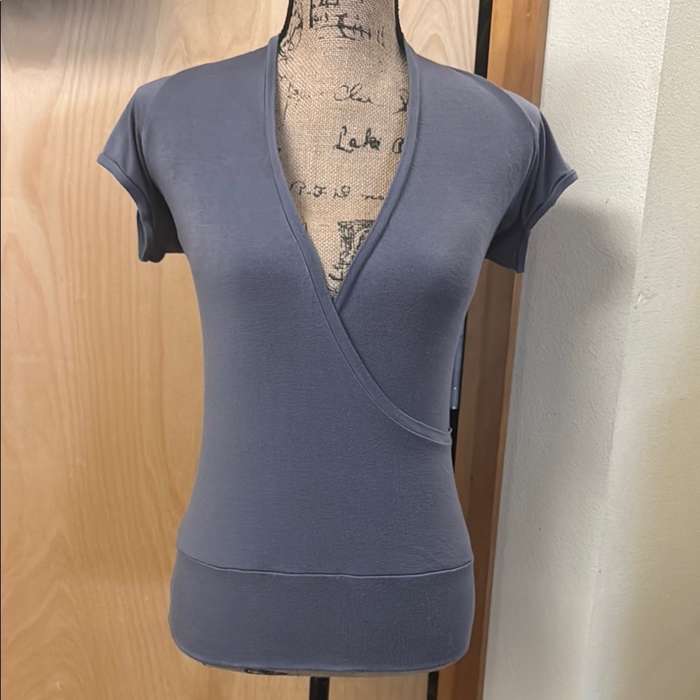 PRANA brand perfect used condition wrap around style with open back shirt. Sz M